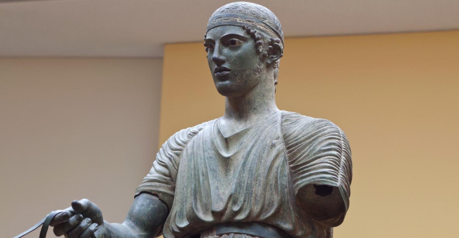 Charioteer statue located at Delphi museum in Greece